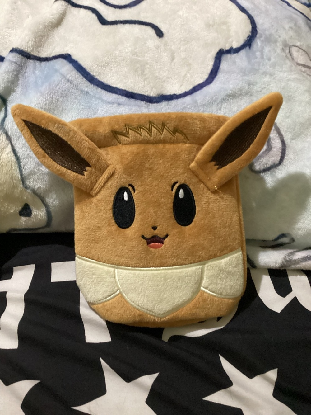 Pokémon Eevee Plush pouch from prismatic evolutions collection box